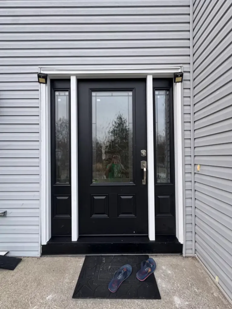 Entry glass door after repair at residential home in Long Island
