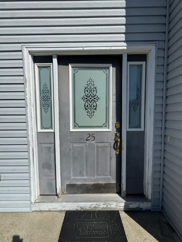 Entry glass door before repair at residential home in Long Island