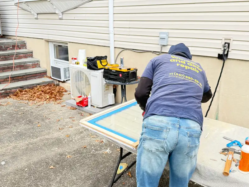 Window glass repair in process at residential home in Long Island